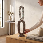 Cargar imagen en el visor de la Galería, Figura decorativa metal Savia estilo industrial 68.5 cm sobre aparador de madera con libros y jarrón.