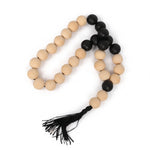 Cargar imagen en el visor de la Galería, Mala Farzin: collar de cuentas de madera natural y negras con borla para meditación y mindfulness.