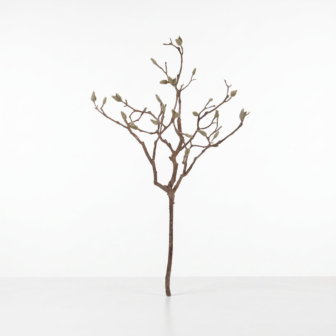 Rama decorativa artificial de magnolia para arreglos y floreros con tallo leñoso y yemas verdes.