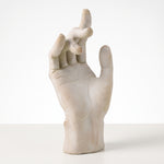 Cargar imagen en el visor de la Galería, Figura Delta de poliresina con forma de mano sobre una superficie para decoración de interiores.