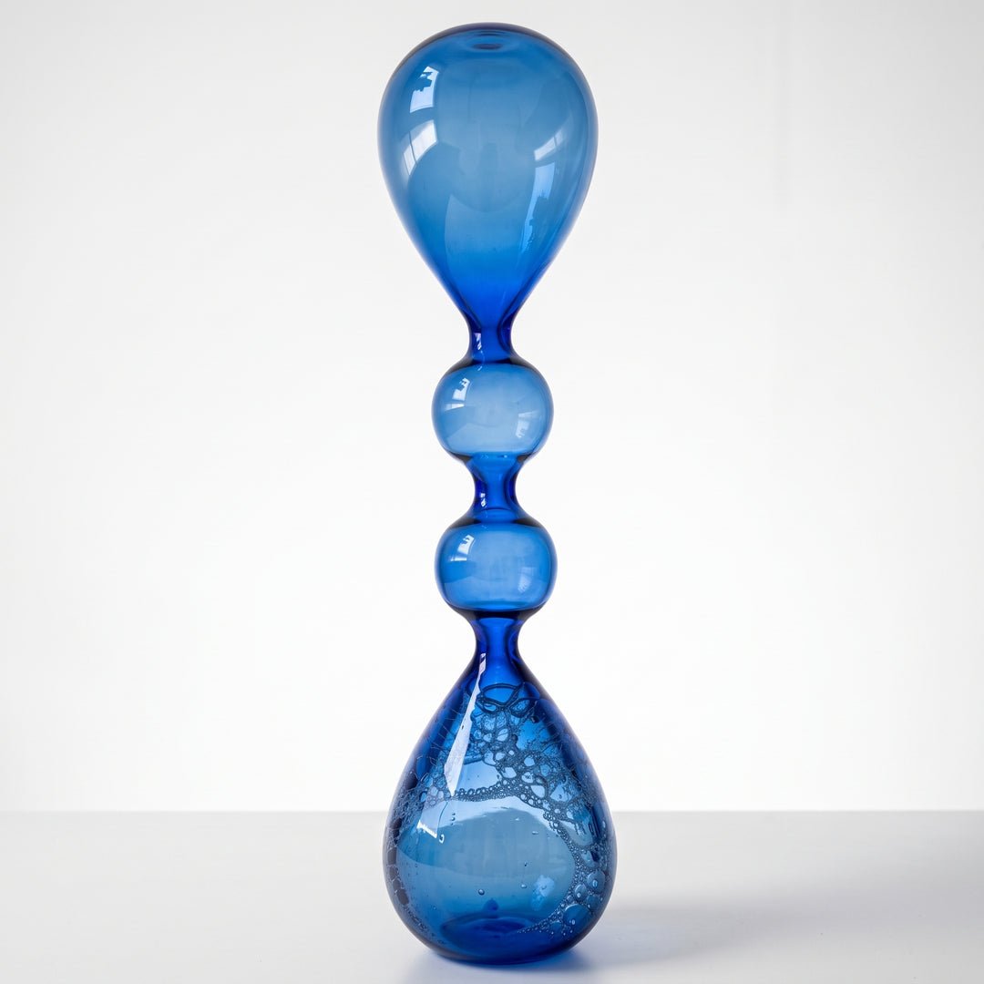 Reloj de agua coralino en cristal azul con burbujas decorativas para escritorio y repisas.